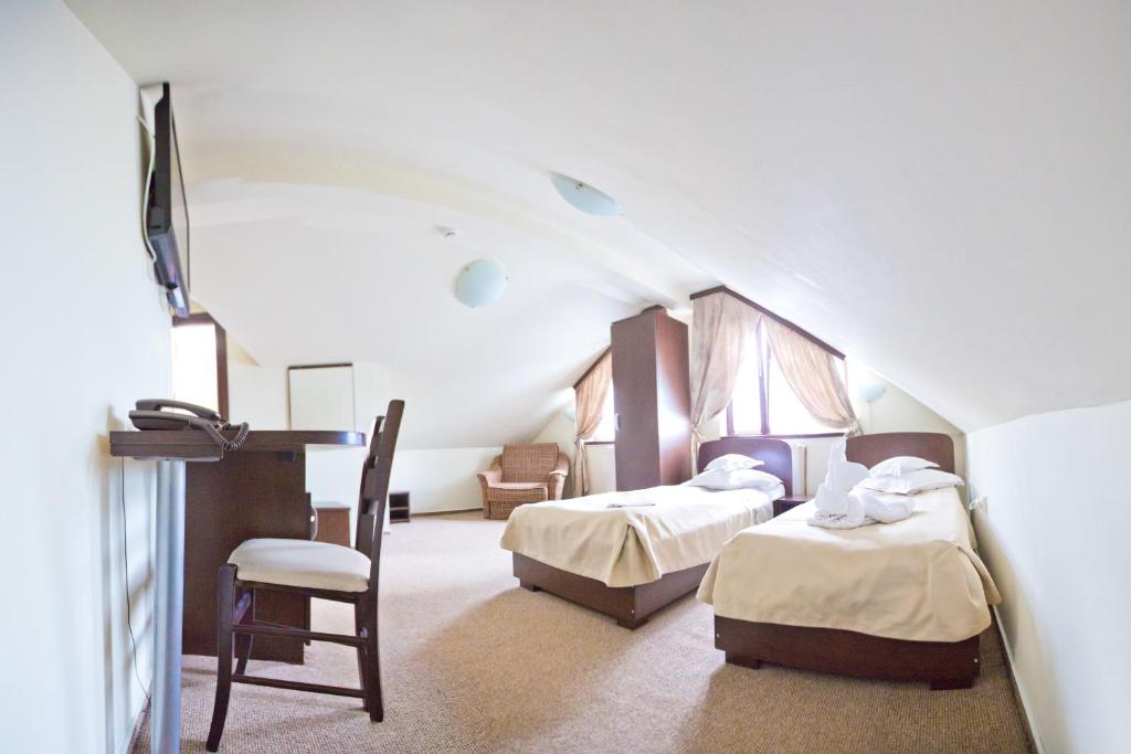 Postel nebo postele na pokoji v ubytování Hotel Piemonte