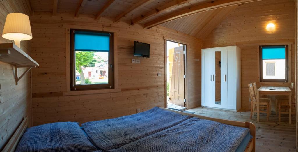 Postel nebo postele na pokoji v ubytování O.W.Cynamon