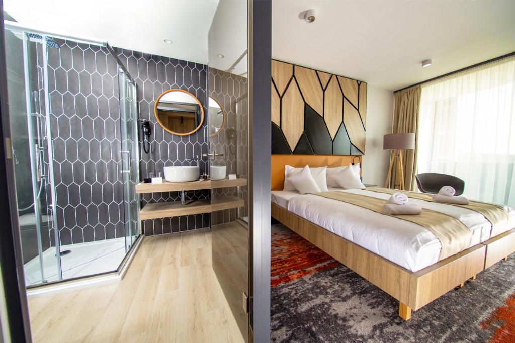 Postel nebo postele na pokoji v ubytování Avar Hotel