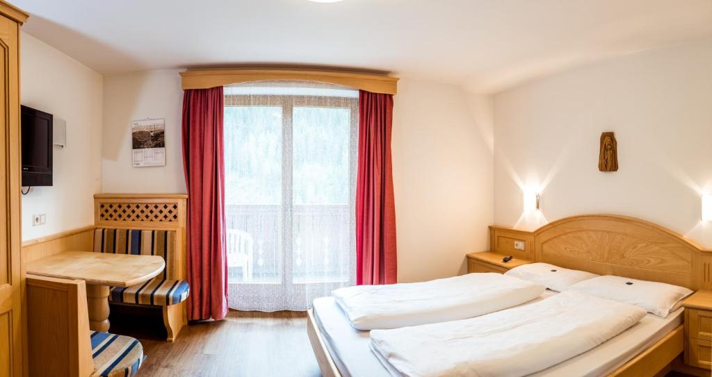 Posteľ alebo postele v izbe v ubytovaní Hotel Vernel