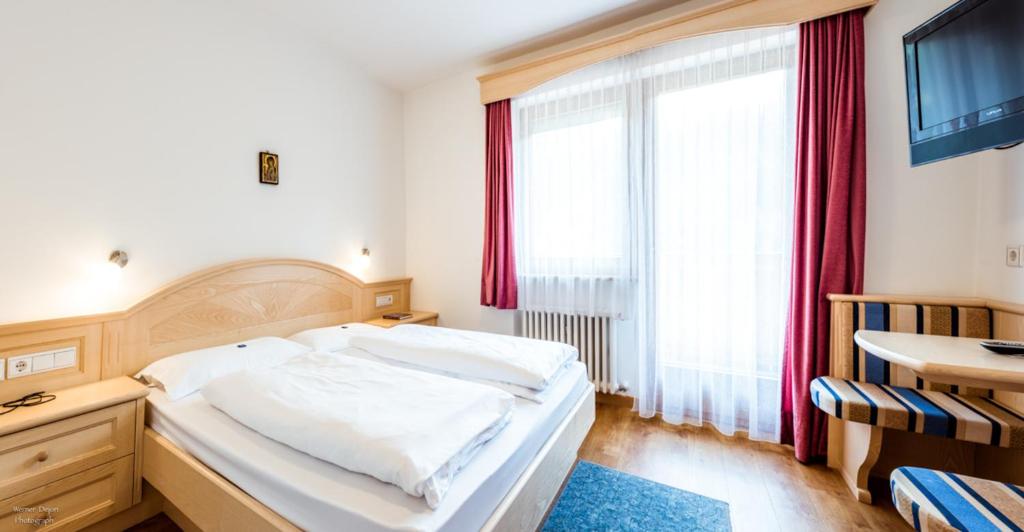 Posteľ alebo postele v izbe v ubytovaní Hotel Vernel