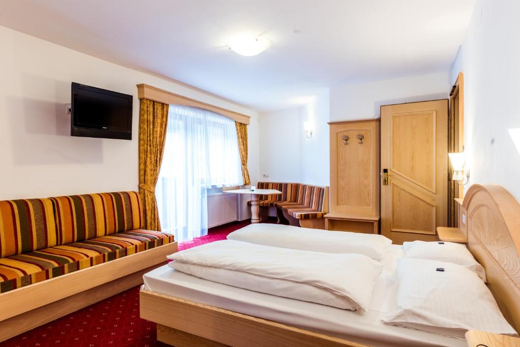 Posteľ alebo postele v izbe v ubytovaní Hotel Vernel