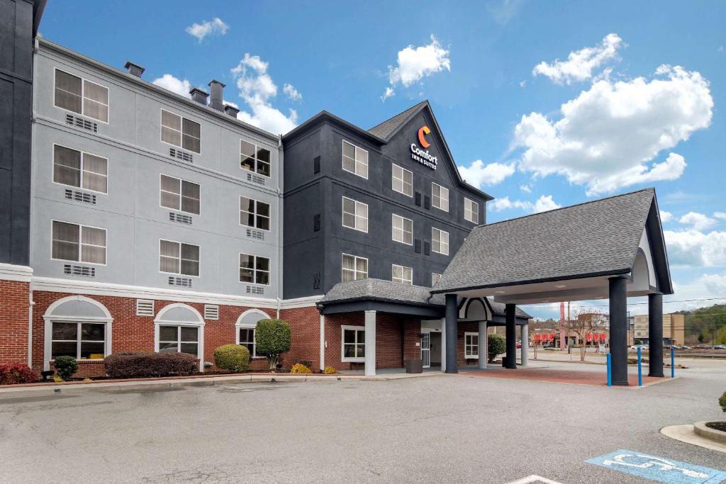 a rendering of the front of a hotel with a parking lot at Comfort Inn & Suites Calhoun South in Calhoun