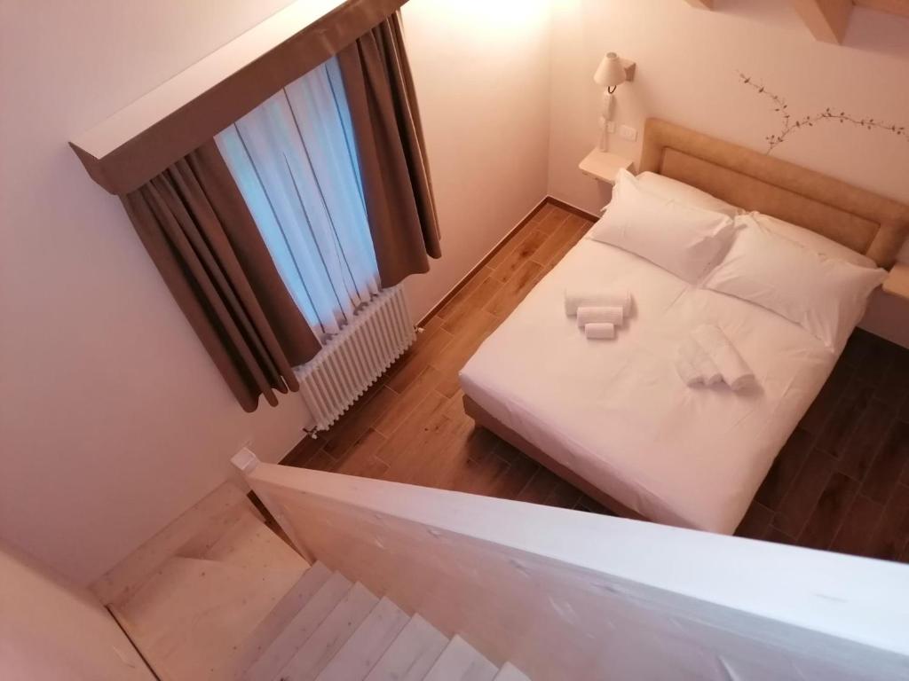 Postel nebo postele na pokoji v ubytování Hotel Rosengarten