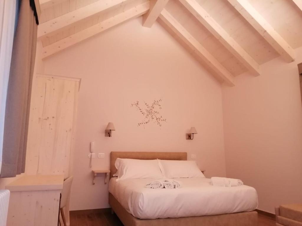 Postel nebo postele na pokoji v ubytování Hotel Rosengarten