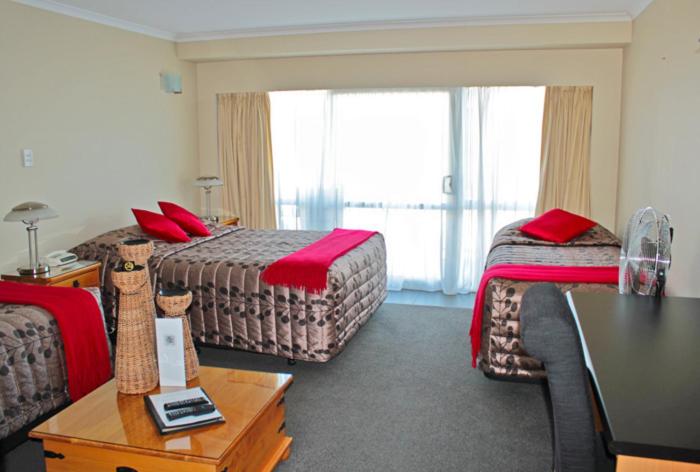 Postel nebo postele na pokoji v ubytování Beachcomber Inn Picton
