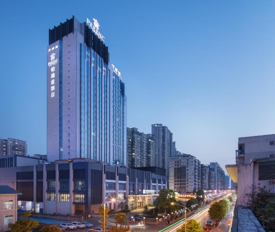 a city skyline with tall buildings and a street at Perenc Hotel in Anshun
