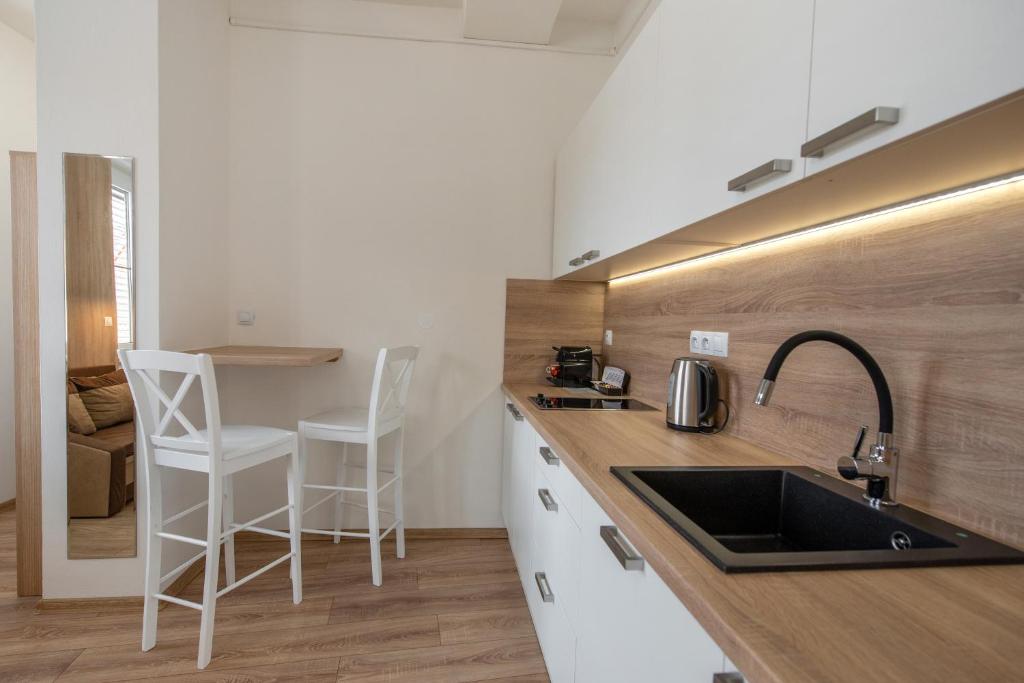 Kuchyň nebo kuchyňský kout v ubytování Soho apartment