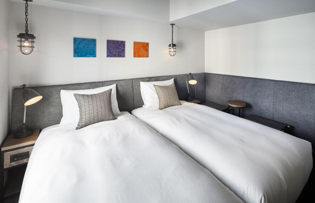 Postel nebo postele na pokoji v ubytování Hotel Resol Akihabara