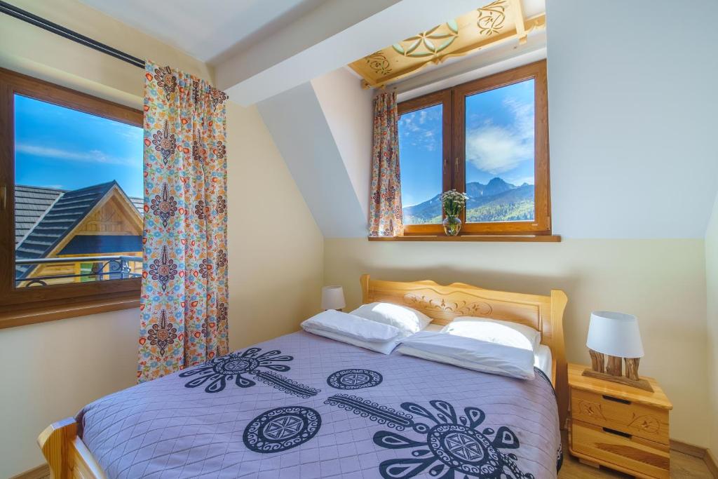 Posteľ alebo postele v izbe v ubytovaní Widokówka Tatry Pokoje i Apartamenty