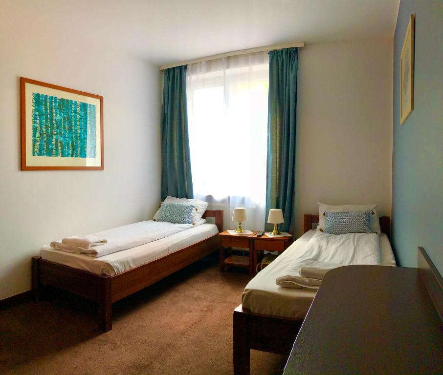 Кровать или кровати в номере Hotel Olecki
