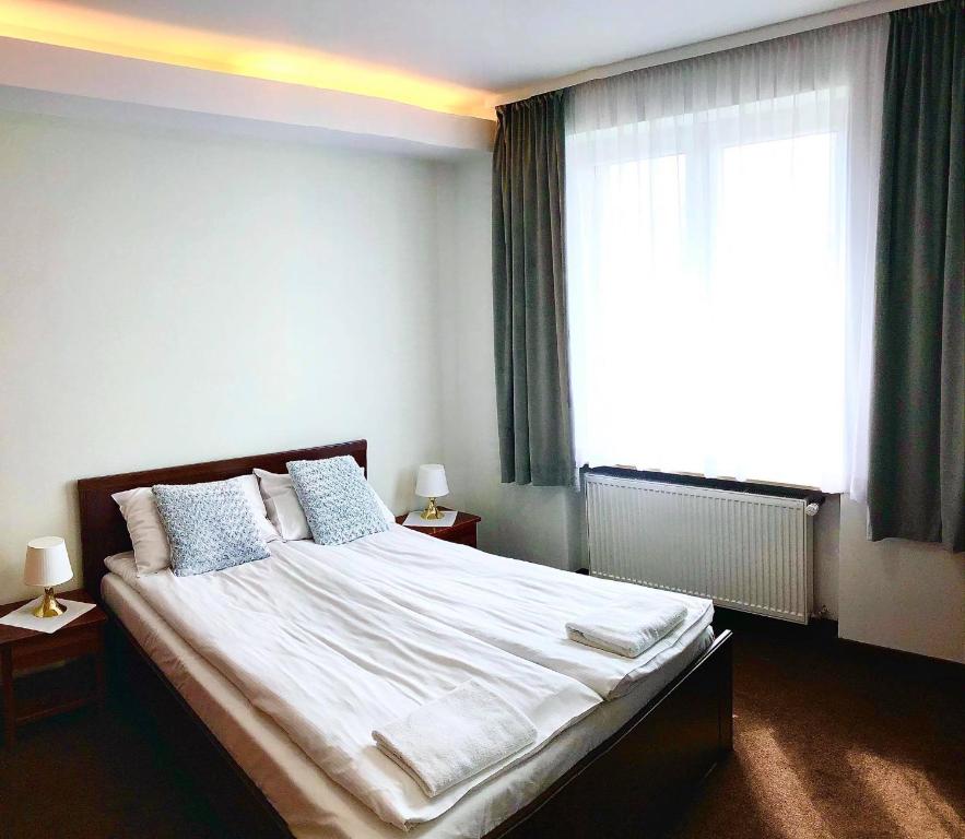 Кровать или кровати в номере Hotel Olecki