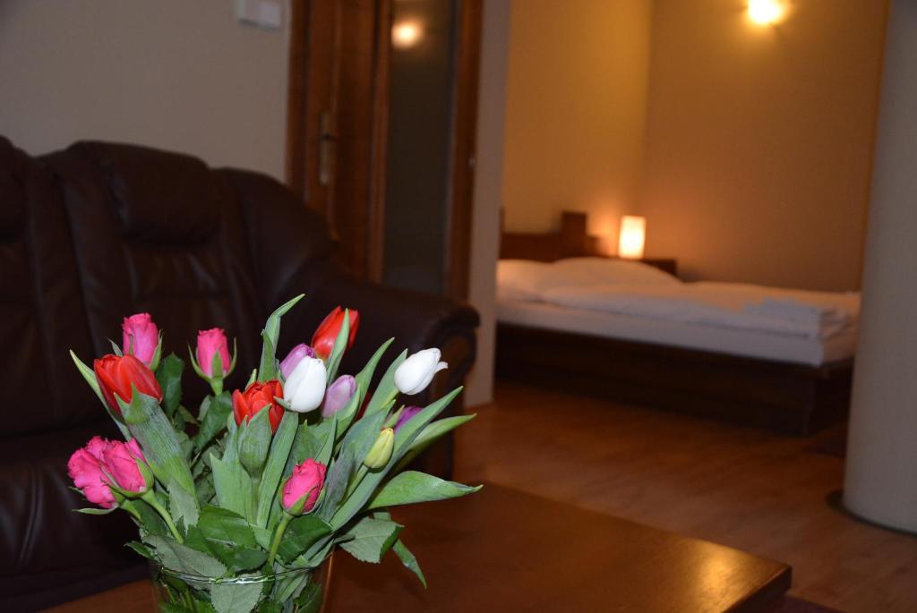 Postel nebo postele na pokoji v ubytování Hotel Banderium
