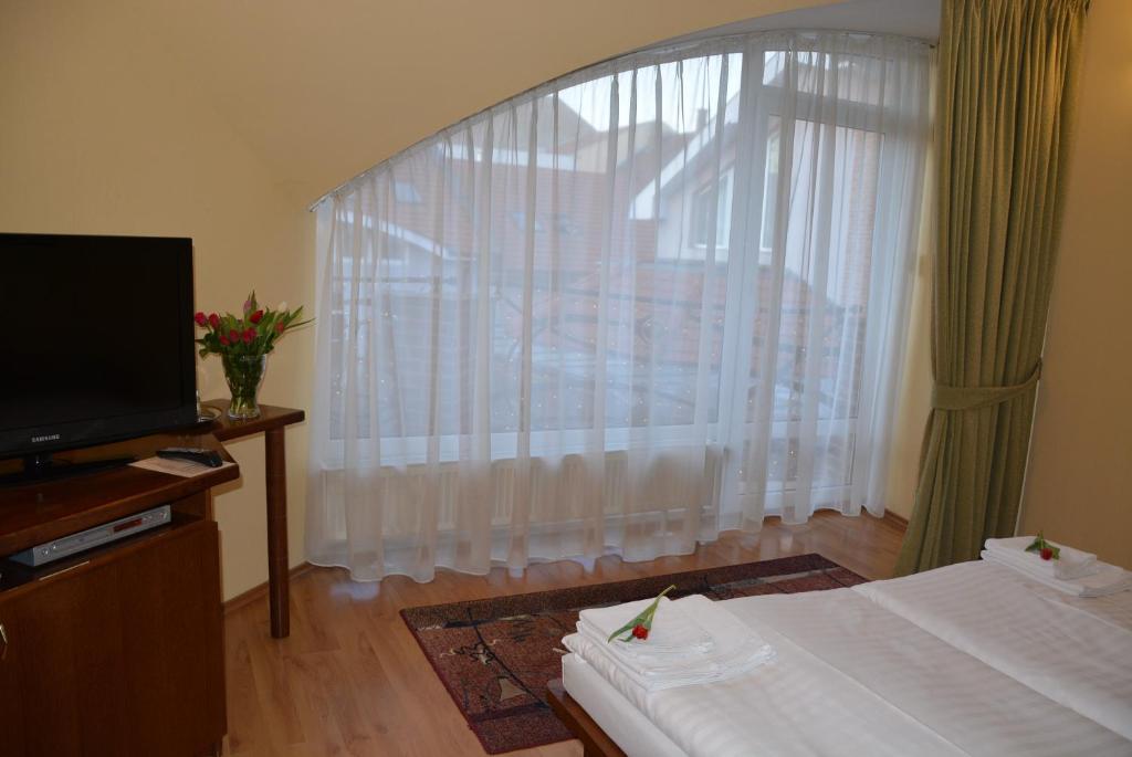 Postel nebo postele na pokoji v ubytování Hotel Banderium
