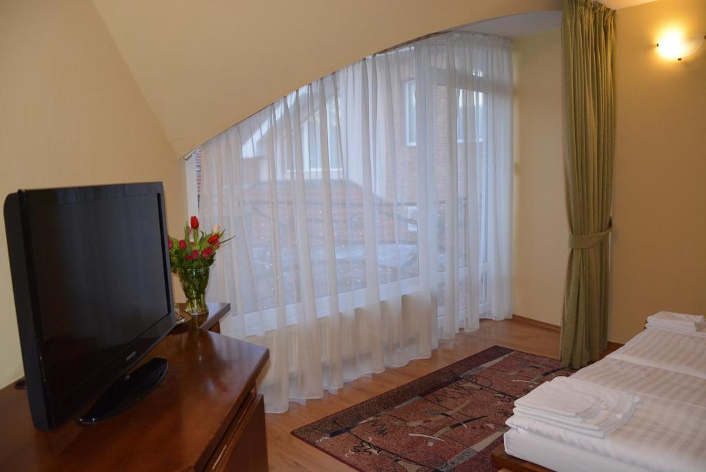 TV a/nebo společenská místnost v ubytování Hotel Banderium
