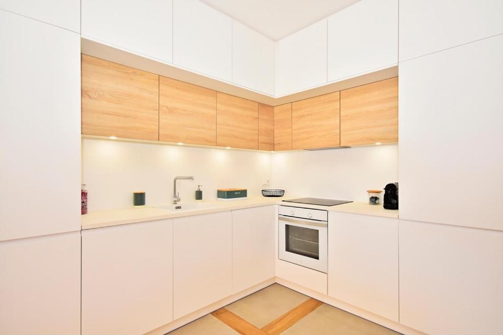 A kitchen or kitchenette at 70sqm private terrace in front of the sea & 107sqm brand new apartment