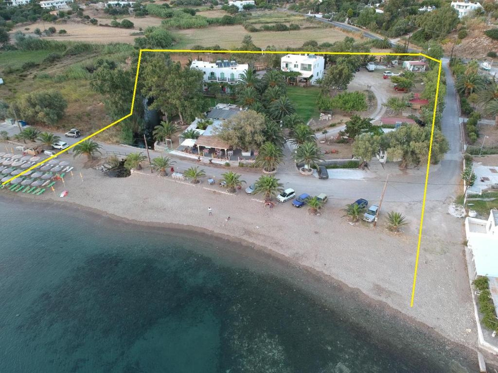 an aerial view of a beach with a yellow line at Pegasus Studios & Apartments in Skiros
