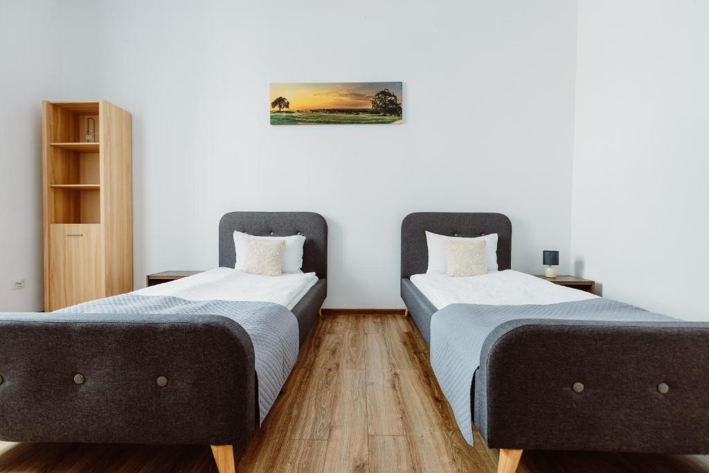 Posteľ alebo postele v izbe v ubytovaní Atticus Apartments