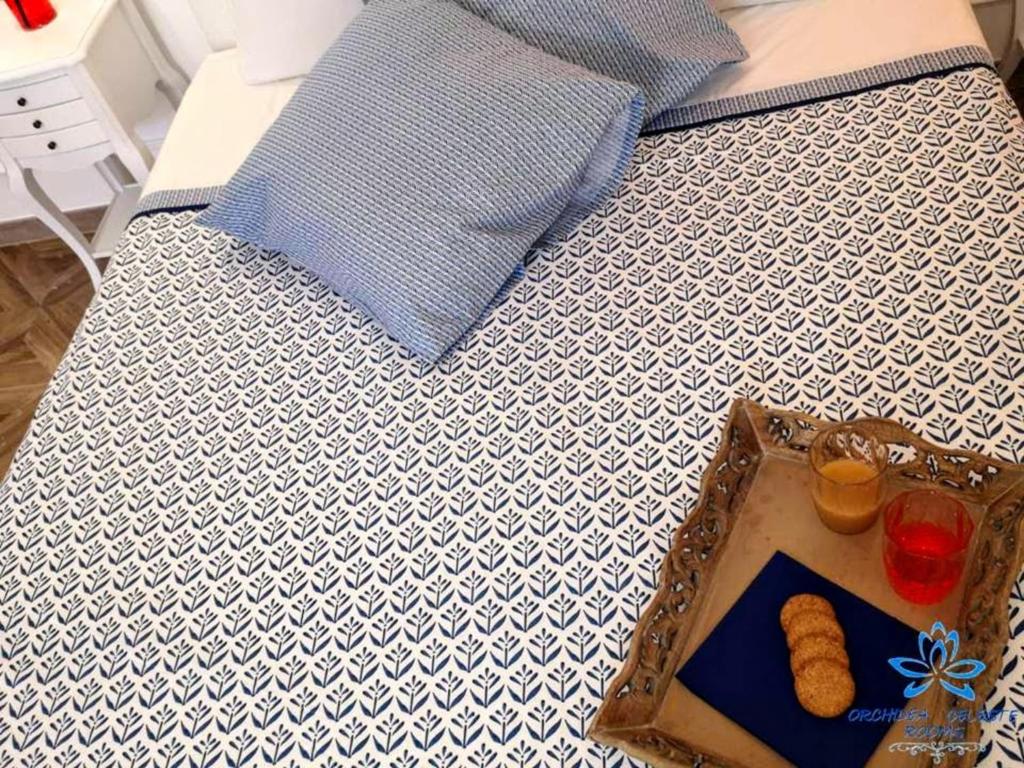 Postel nebo postele na pokoji v ubytování B&B Orchidea Celeste