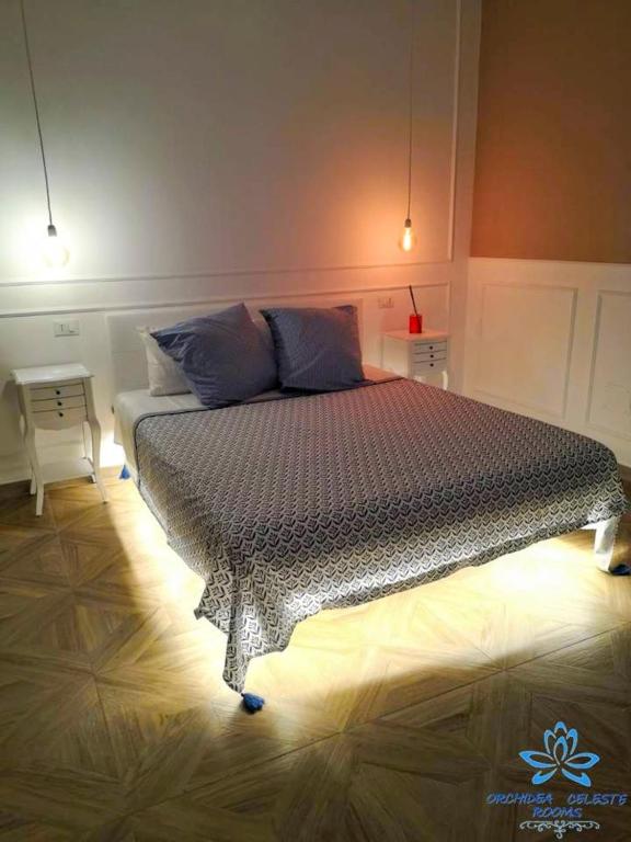Postel nebo postele na pokoji v ubytování B&B Orchidea Celeste