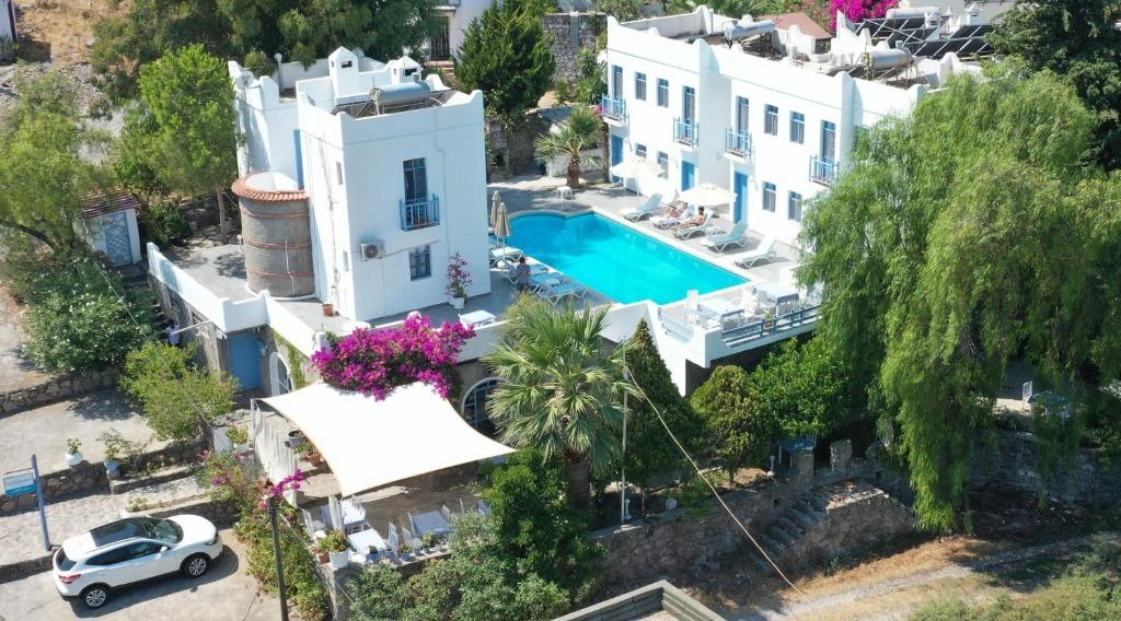 an aerial view of a villa with a swimming pool at Panorama Hotel Bodrum in Golturkbuku