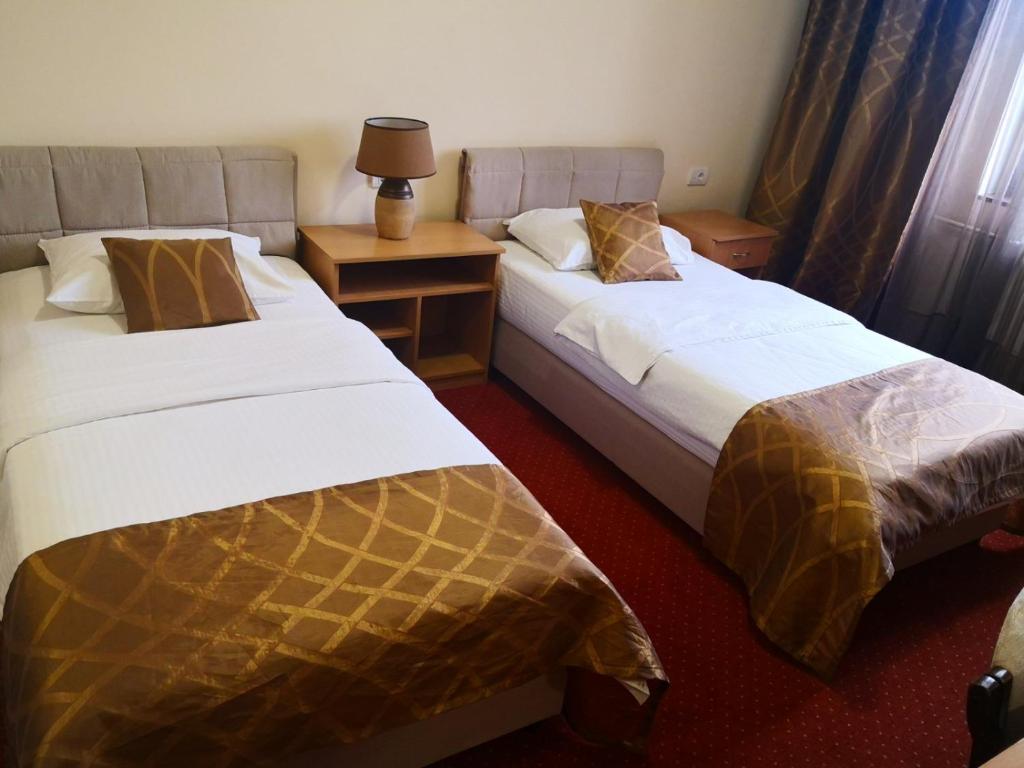 Postel nebo postele na pokoji v ubytování Hotel N