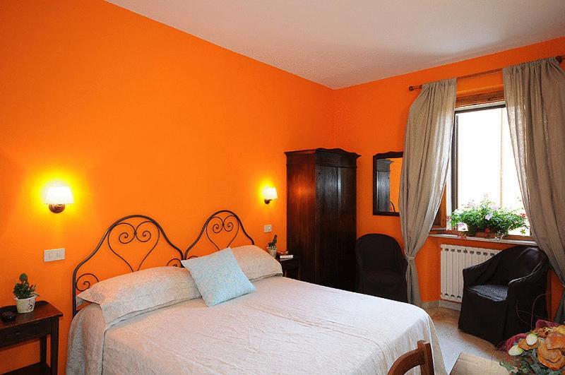 Postel nebo postele na pokoji v ubytování Albergo Duomo