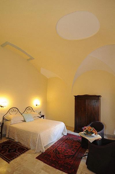 Postel nebo postele na pokoji v ubytování Albergo Duomo
