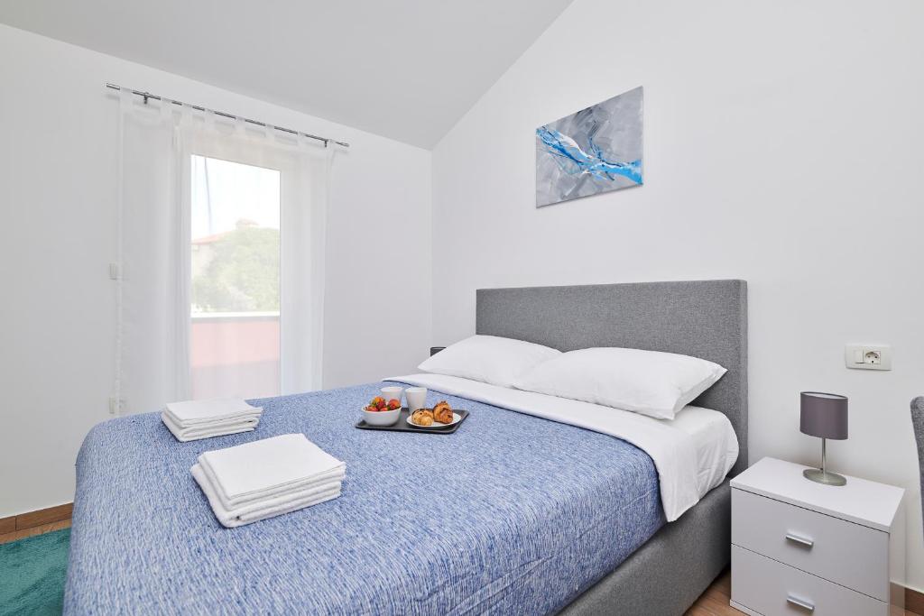 Postel nebo postele na pokoji v ubytování Villa Maris