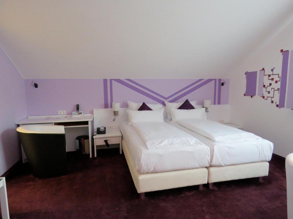 Postel nebo postele na pokoji v ubytování Hotel Residenz Hössinger