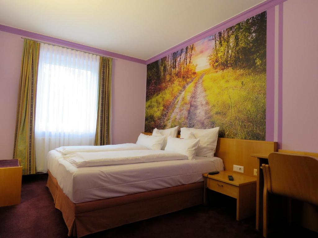 Postel nebo postele na pokoji v ubytování Hotel Residenz Hössinger