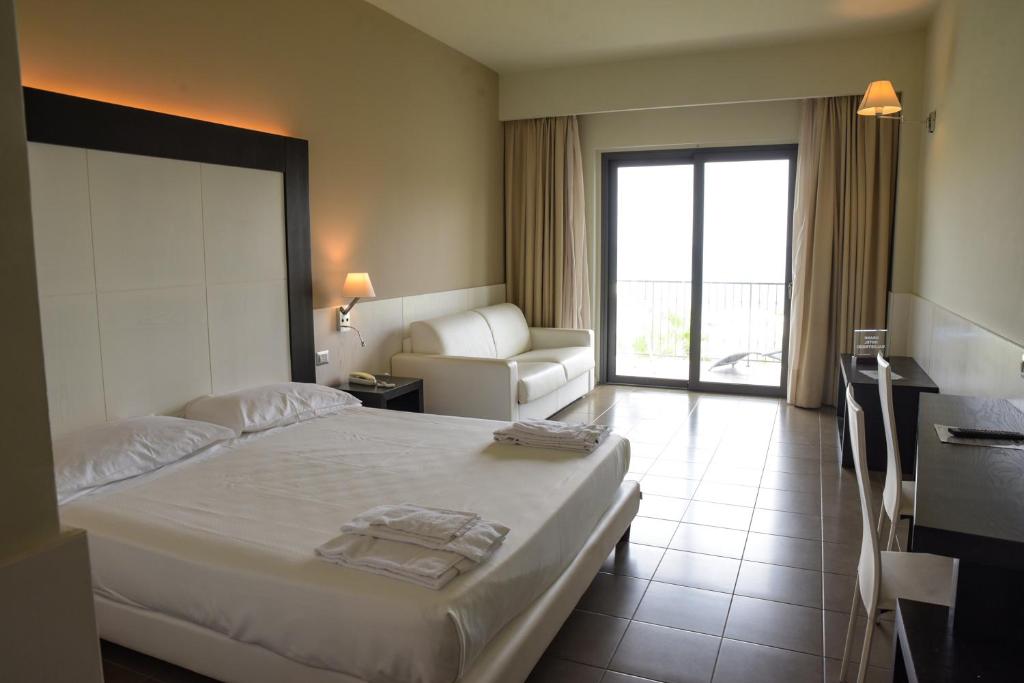 Postel nebo postele na pokoji v ubytování Grand Hotel Balestrieri