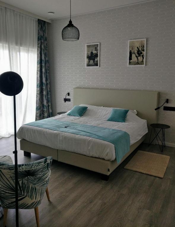 Postel nebo postele na pokoji v ubytování B & B De Veurnse Slaper