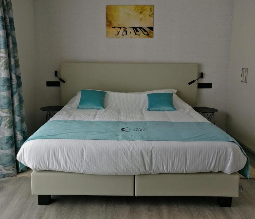 Postel nebo postele na pokoji v ubytování B & B De Veurnse Slaper