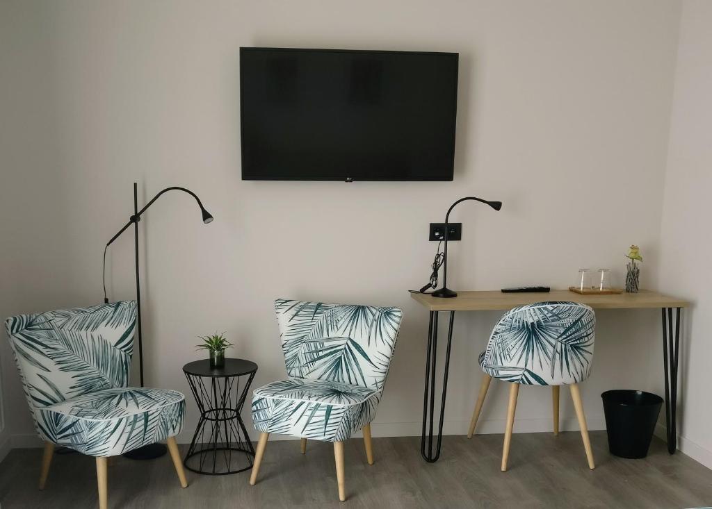 TV a/nebo společenská místnost v ubytování B & B De Veurnse Slaper