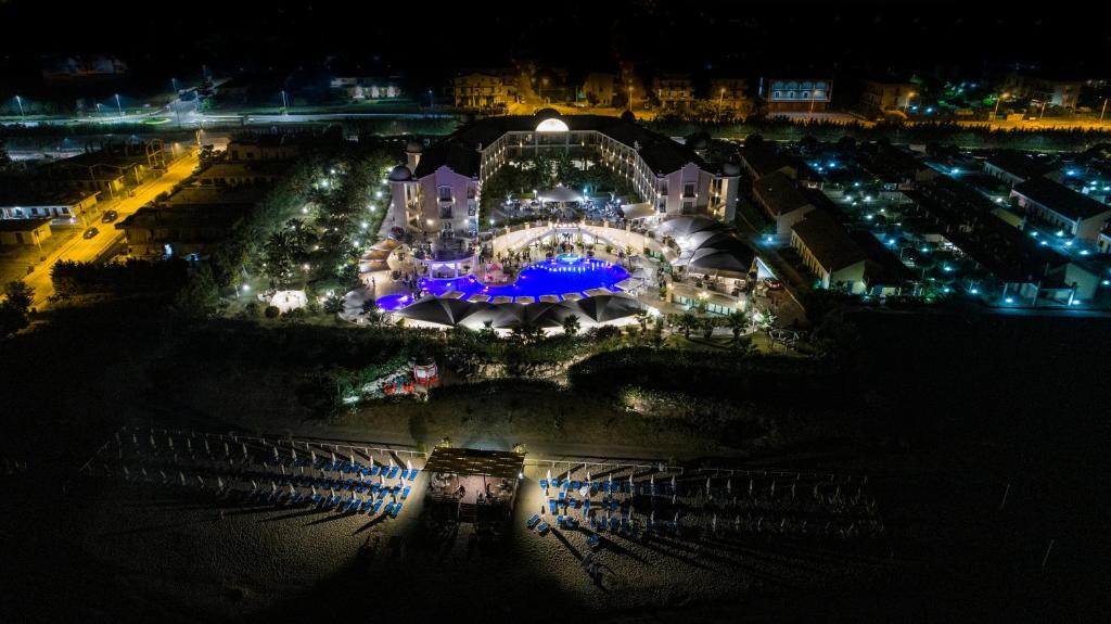 an aerial view of a building with lights at night at Grand Hotel Balestrieri in Torre Melissa
