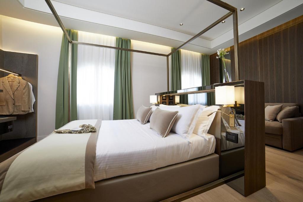 Posteľ alebo postele v izbe v ubytovaní Messori Suites
