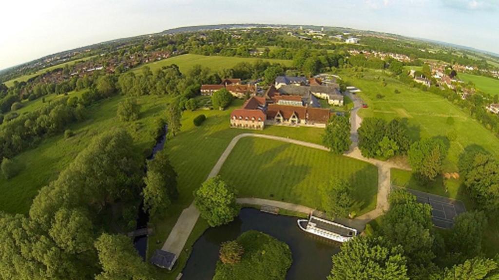 an aerial view of a large estate with a house at voco Oxford Thames by IHG in Oxford
