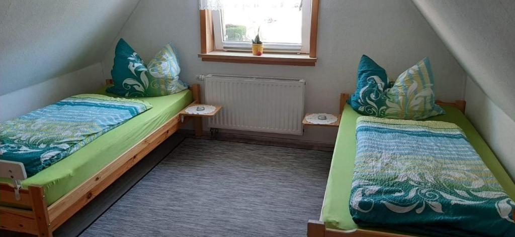 Postel nebo postele na pokoji v ubytování Ferienwohnung Aue