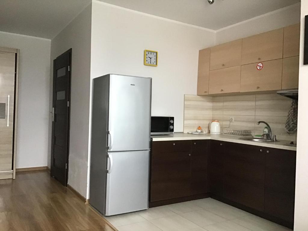 Kuchyňa alebo kuchynka v ubytovaní Młynowa - Apartamenty Centrum New