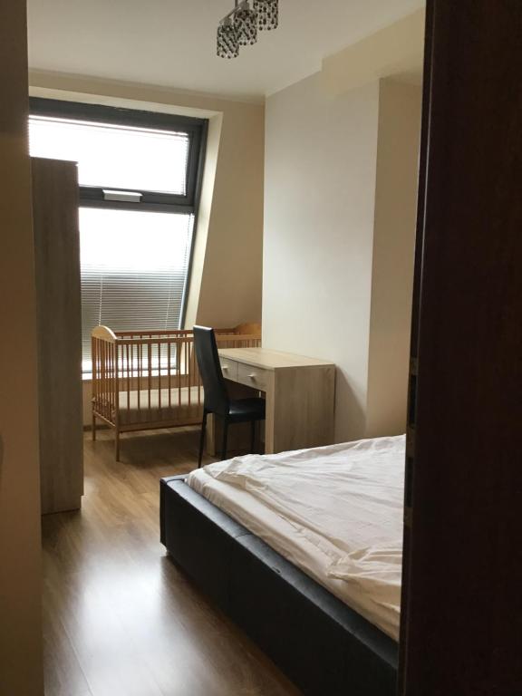 Posteľ alebo postele v izbe v ubytovaní Młynowa - Apartamenty Centrum New