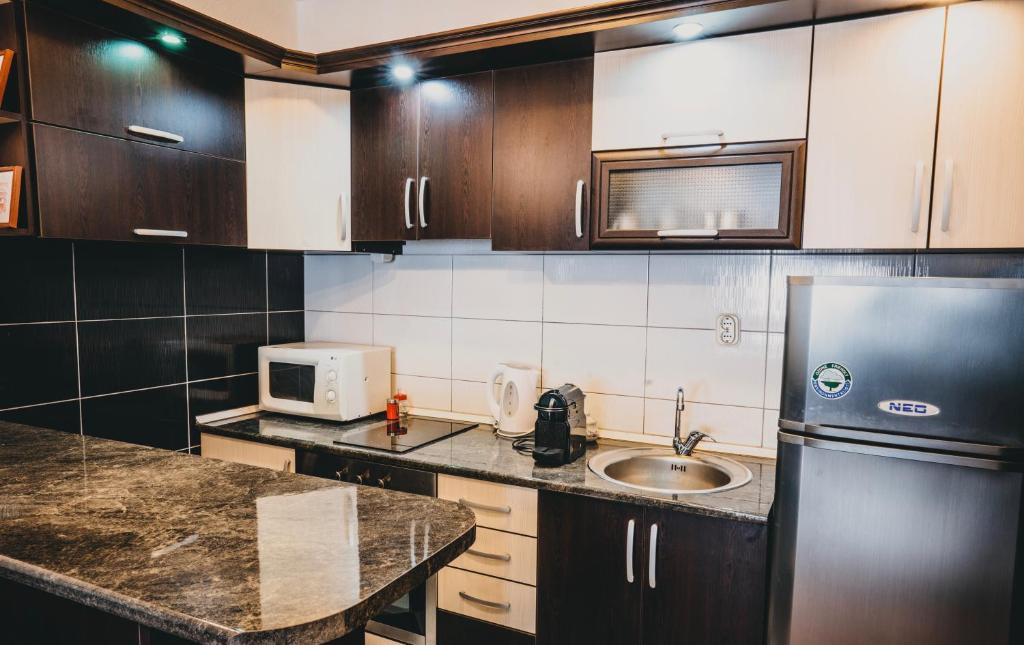 Kuchyň nebo kuchyňský kout v ubytování Villa Stefano