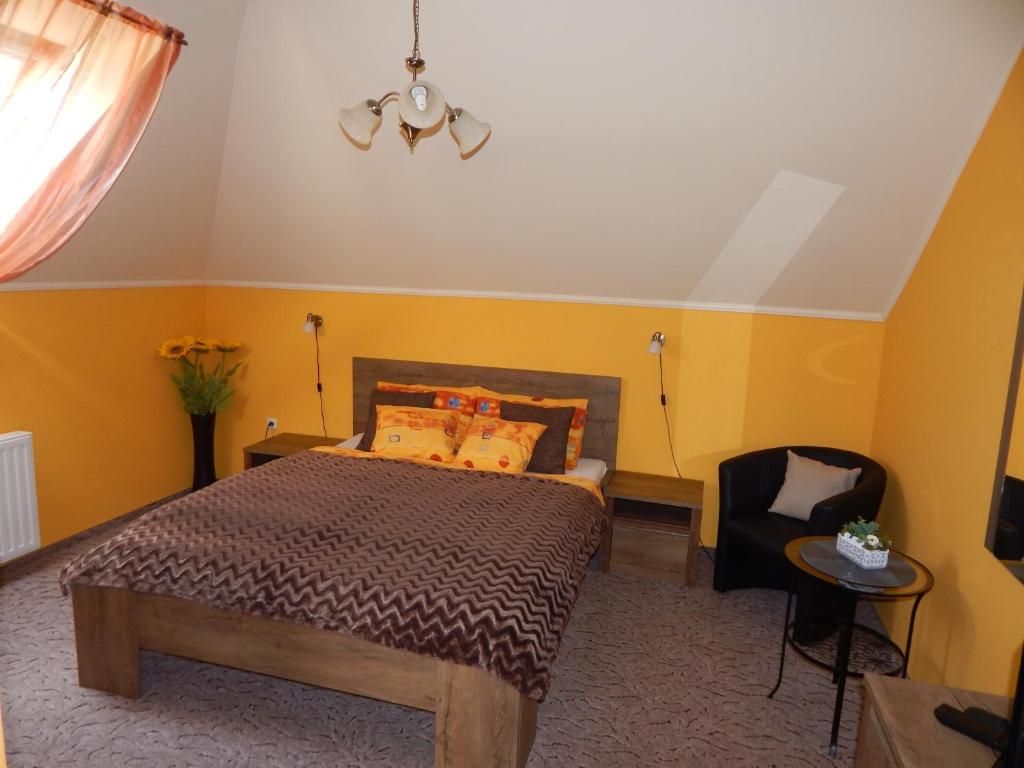 Posteľ alebo postele v izbe v ubytovaní Völgy Apartman