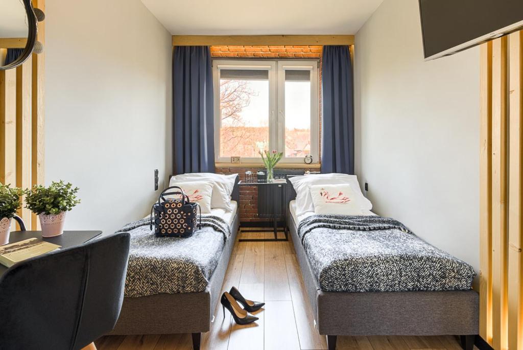 Posteľ alebo postele v izbe v ubytovaní Apartament Alicja, ścisłe centrum, Orkana 3