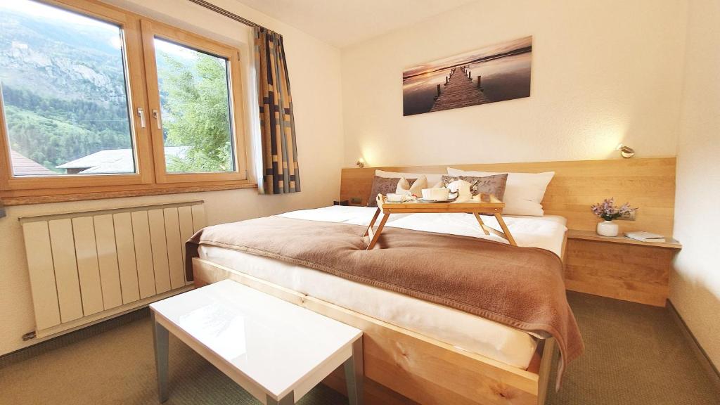 Postel nebo postele na pokoji v ubytování Appartements-Pension Reinstadler