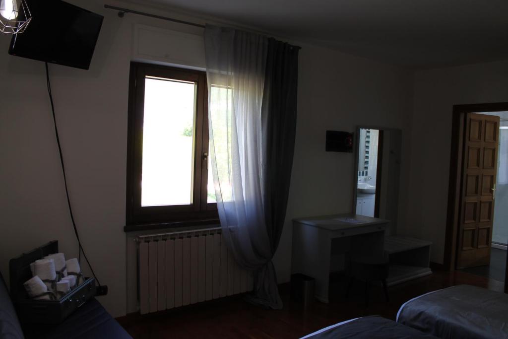 TV a/nebo společenská místnost v ubytování B&B La Casa di Sirio