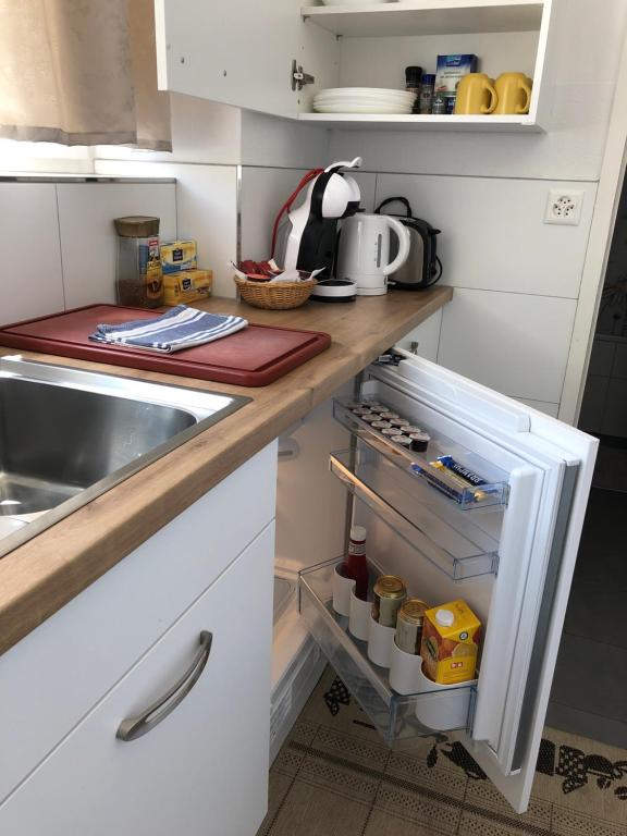 Kuchyň nebo kuchyňský kout v ubytování Apartment Italy
