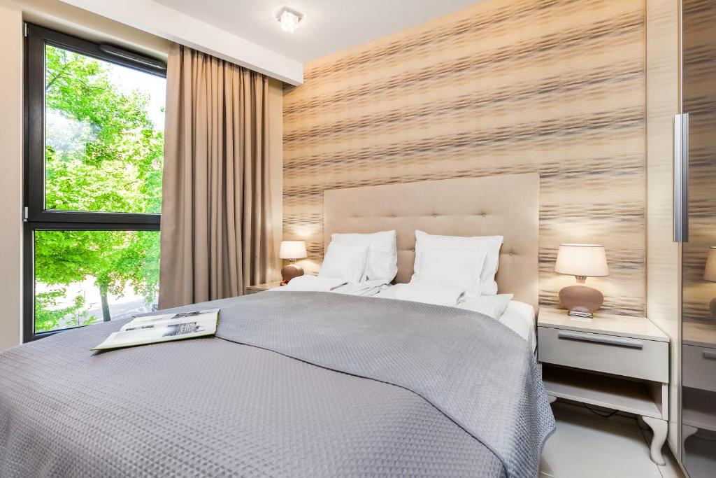 Posteľ alebo postele v izbe v ubytovaní Happy Stay OldNova Deluxe Apartment 335