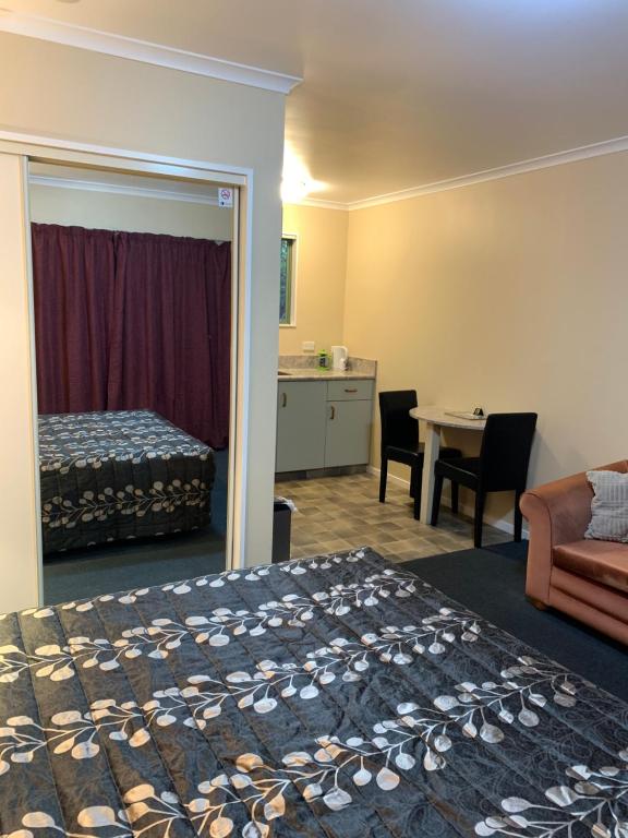 Postel nebo postele na pokoji v ubytování Aldan Lodge