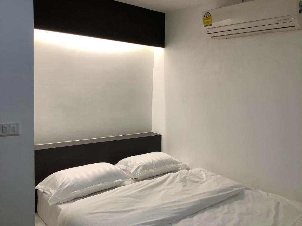 Postel nebo postele na pokoji v ubytování Room@Nimman